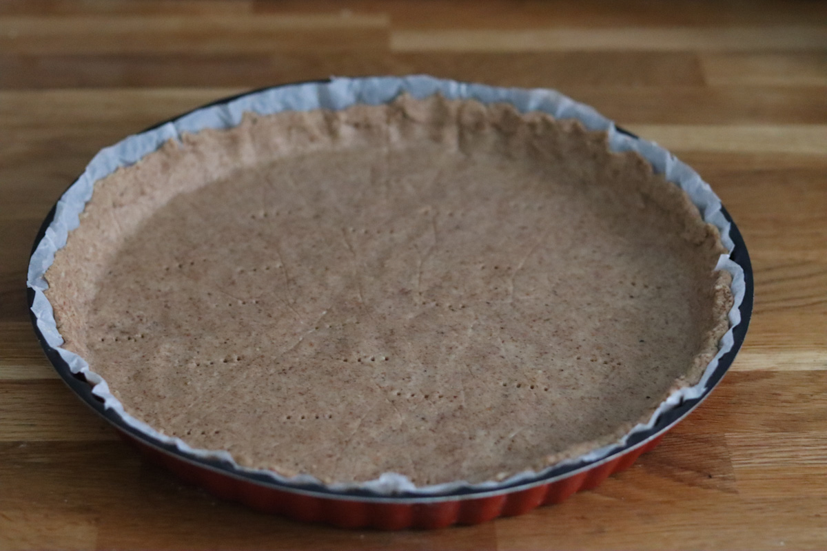 pie crust over a parchement paper in a pie tin. 