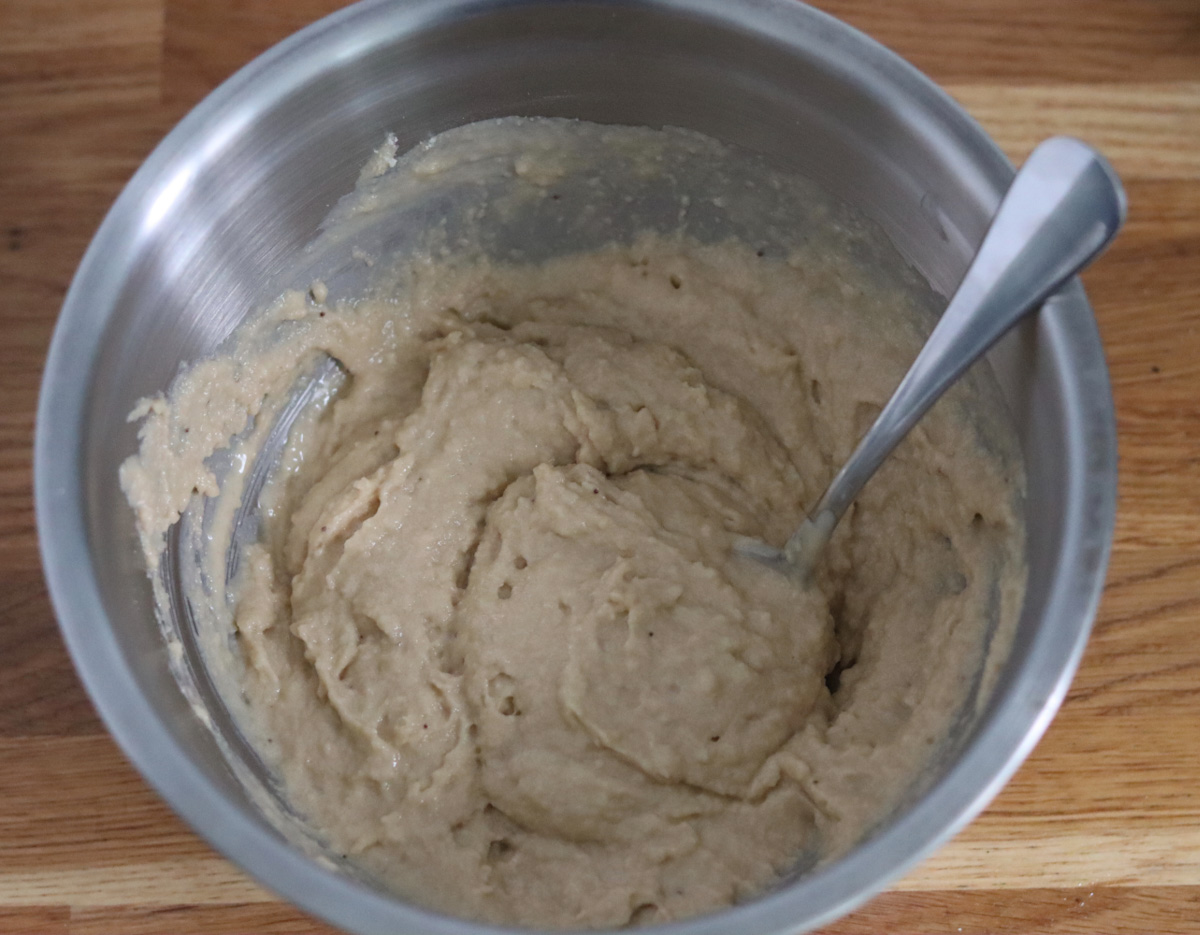 all the wet and dry ingredients mixed together in a large bowl with a spoon