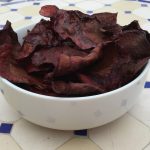 beetroot chips in a white bowl on a table
