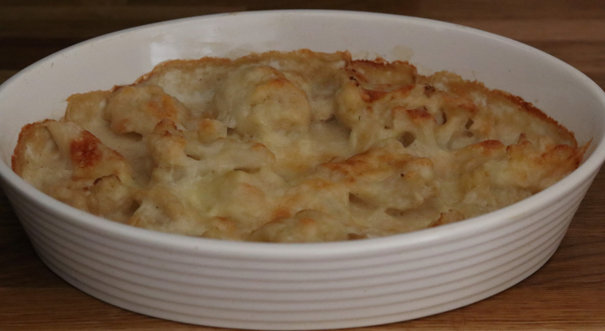 Cauliflower casserole in a white baking dish