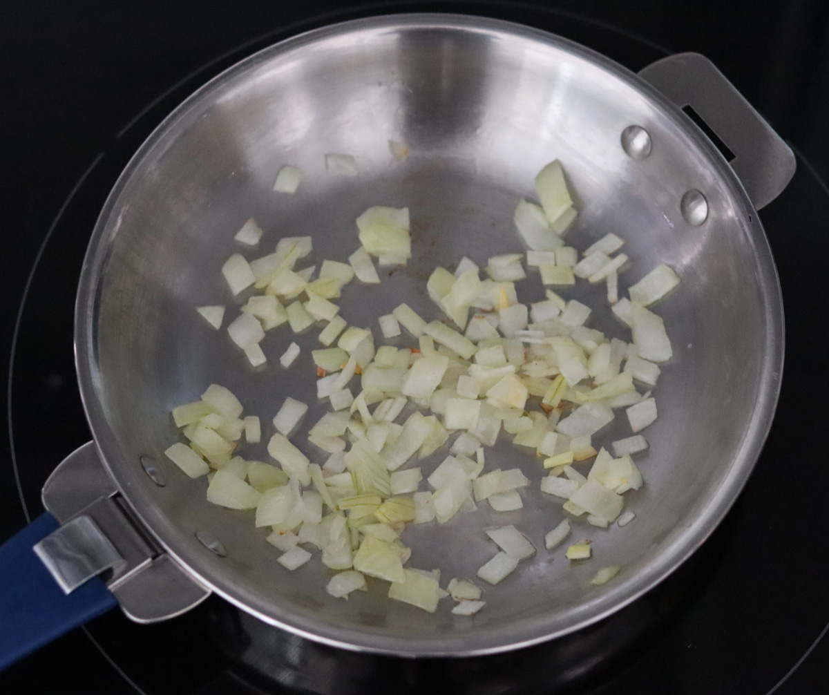 diced onion cooking in a skillet