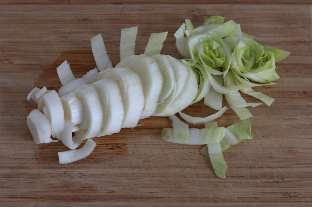 a sliced endive on a cutting board