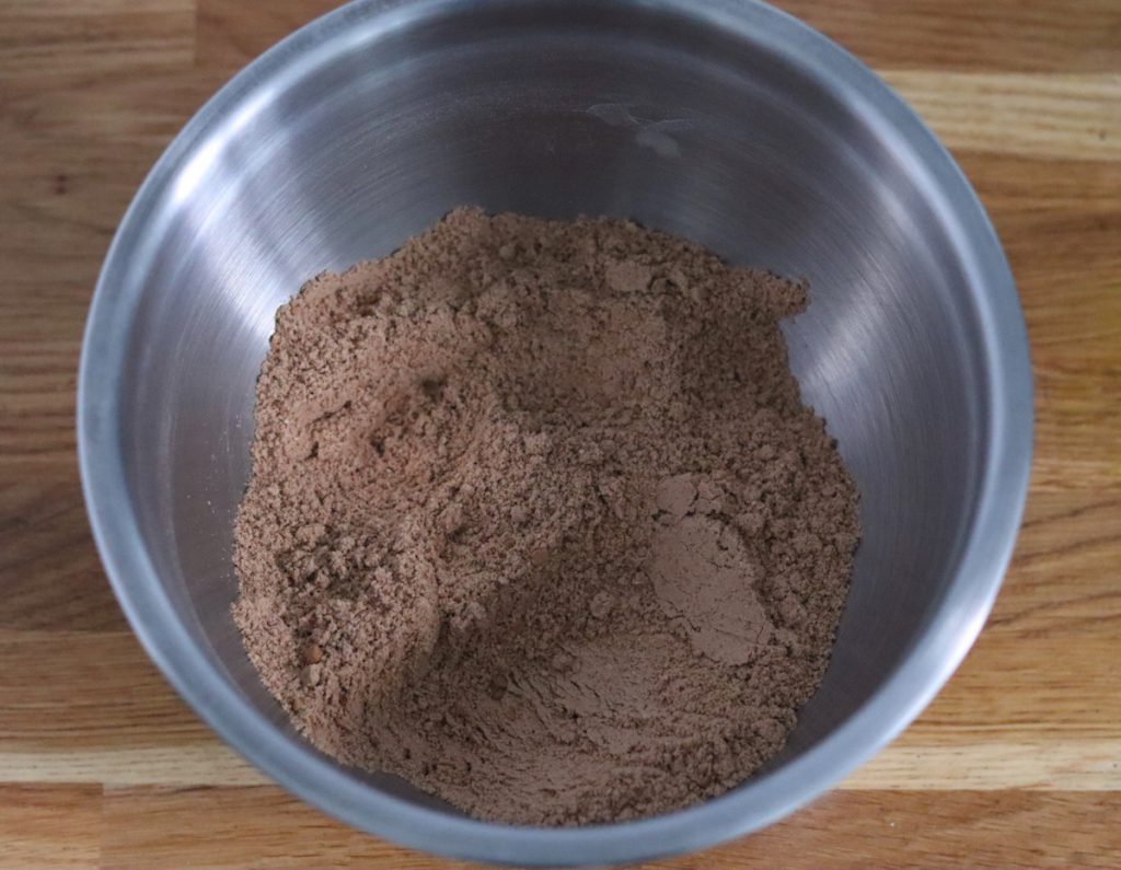 all the dry ingredients for the heart shaped chocolate cakes mixed in a large bowl