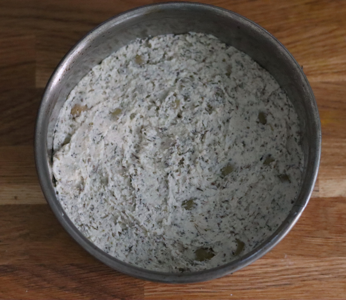 The focaccia batter in a round tin