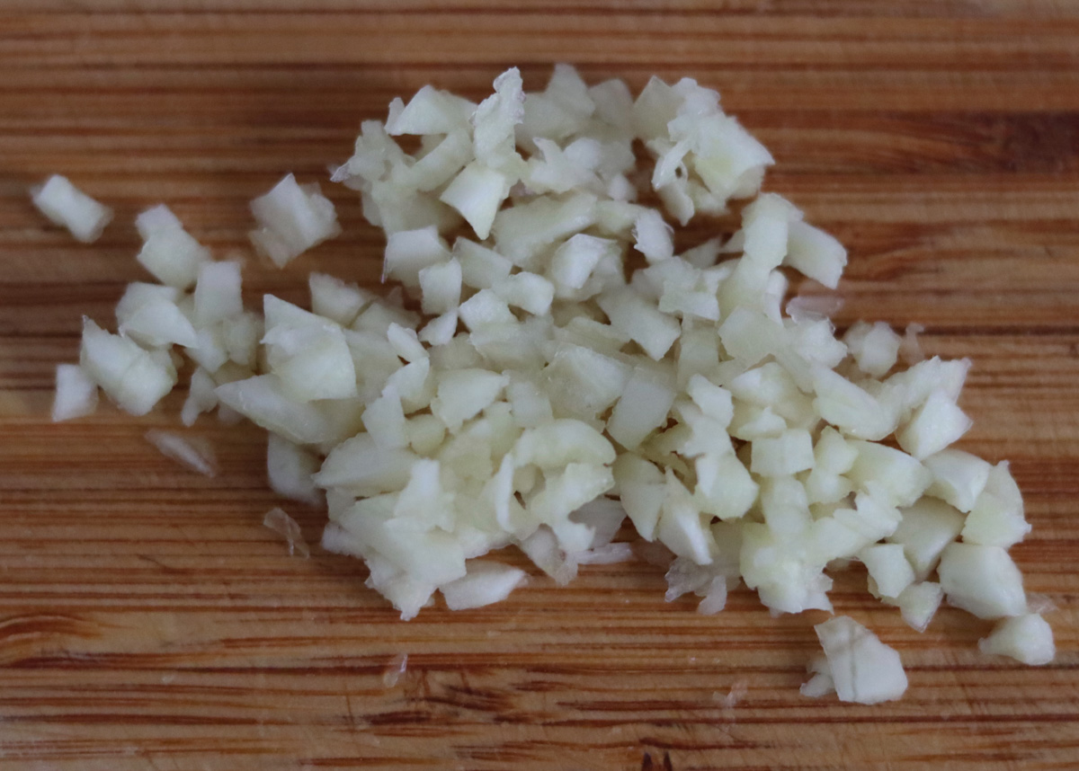 sliced onion on a wooden cut board