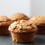 4 pumpkin muffins on a tray