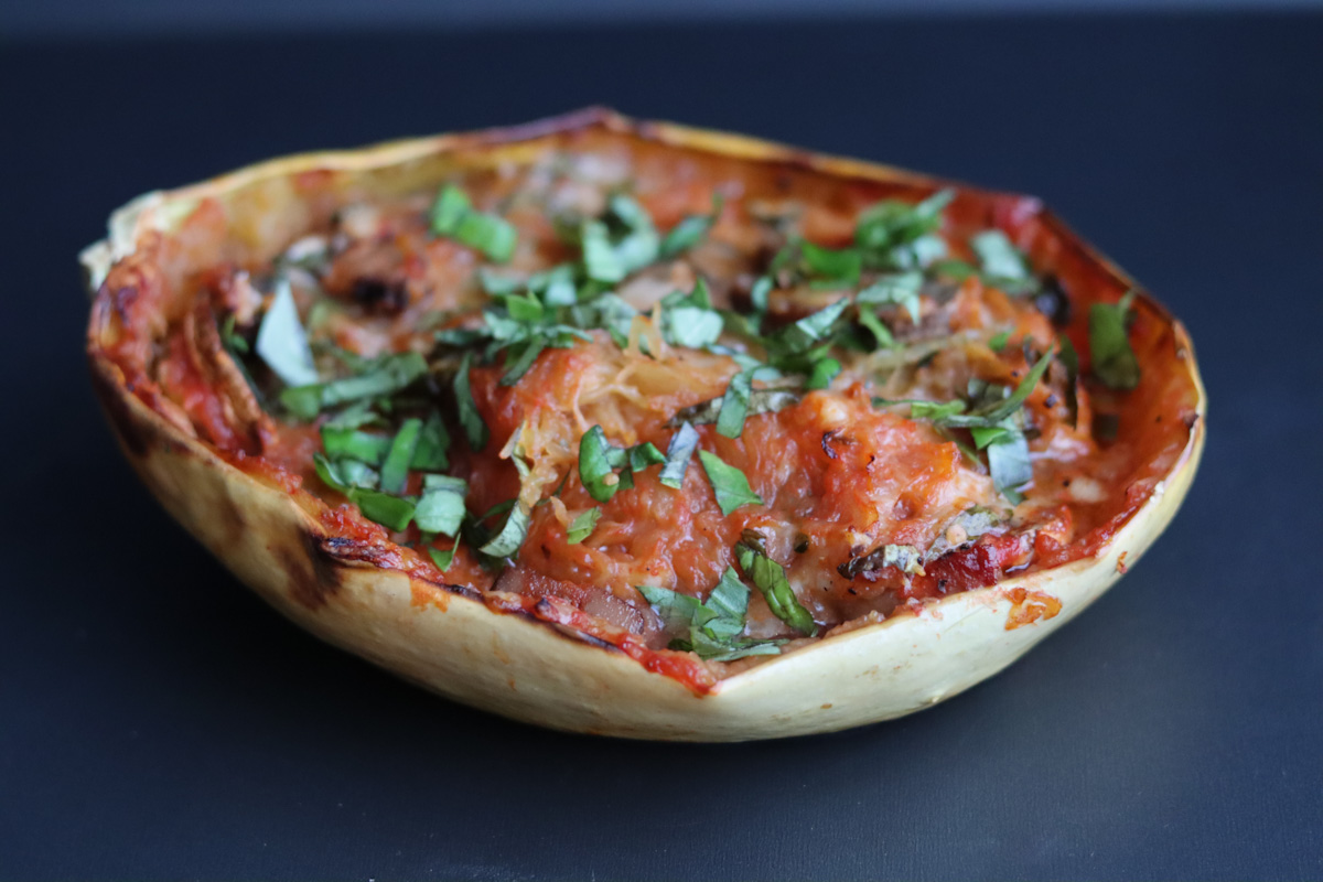 stuffed spaghetti squash with chopped basil on top