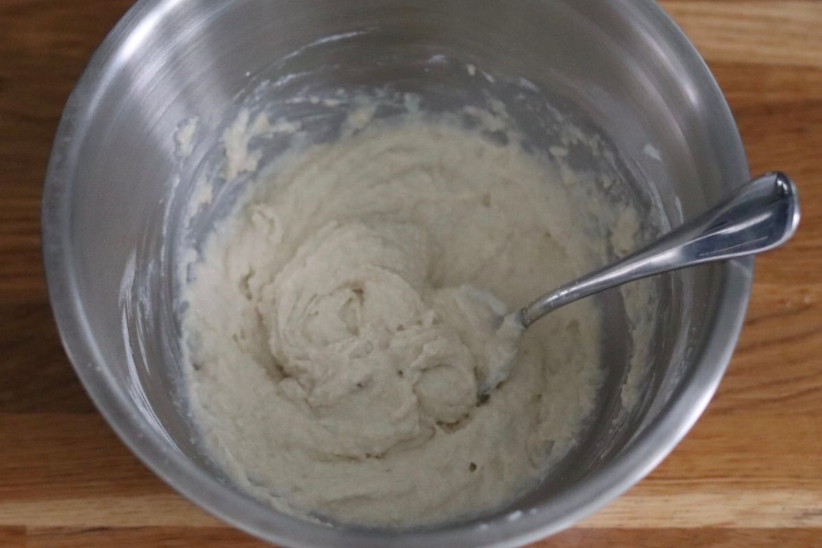 biscuits batter in a large bowl and a spoon