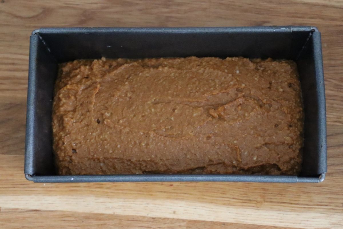 gingerbread loaf batter in a rectangular tin