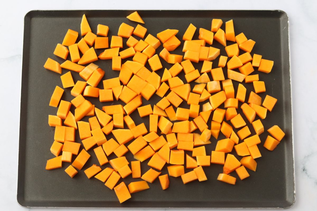 butternut squash cubes on a baking tray