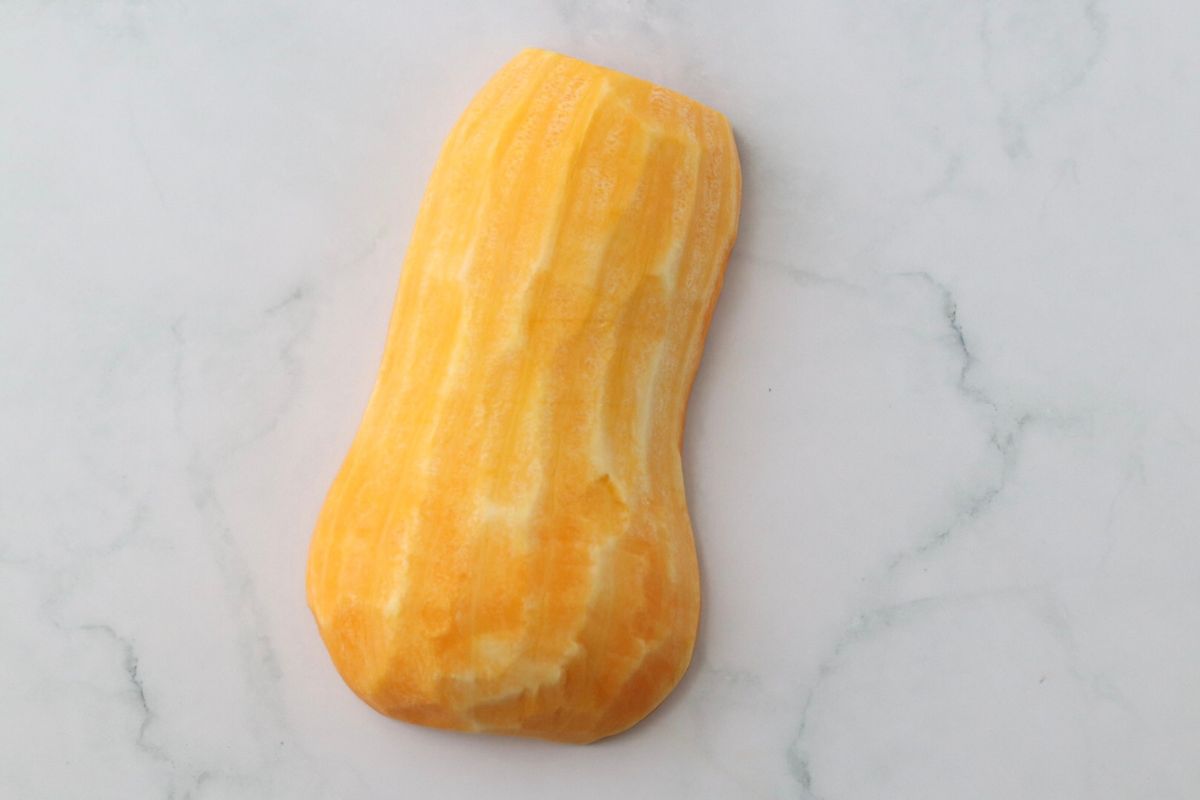 one half of a butternut squash completely peeled