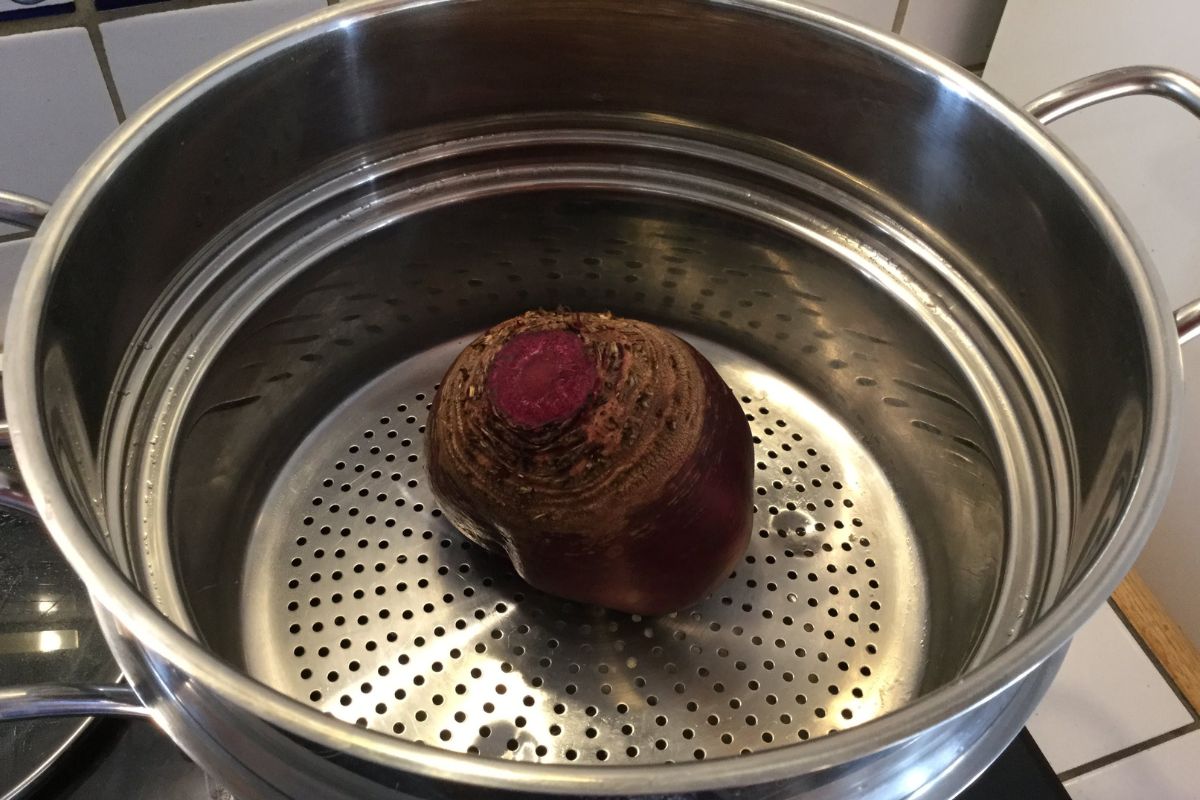 a beetroot in a steamer basket