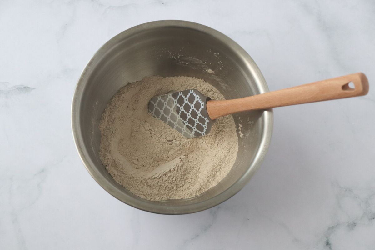 buckwheat flour and sea salt combined in a bowl with a spatula