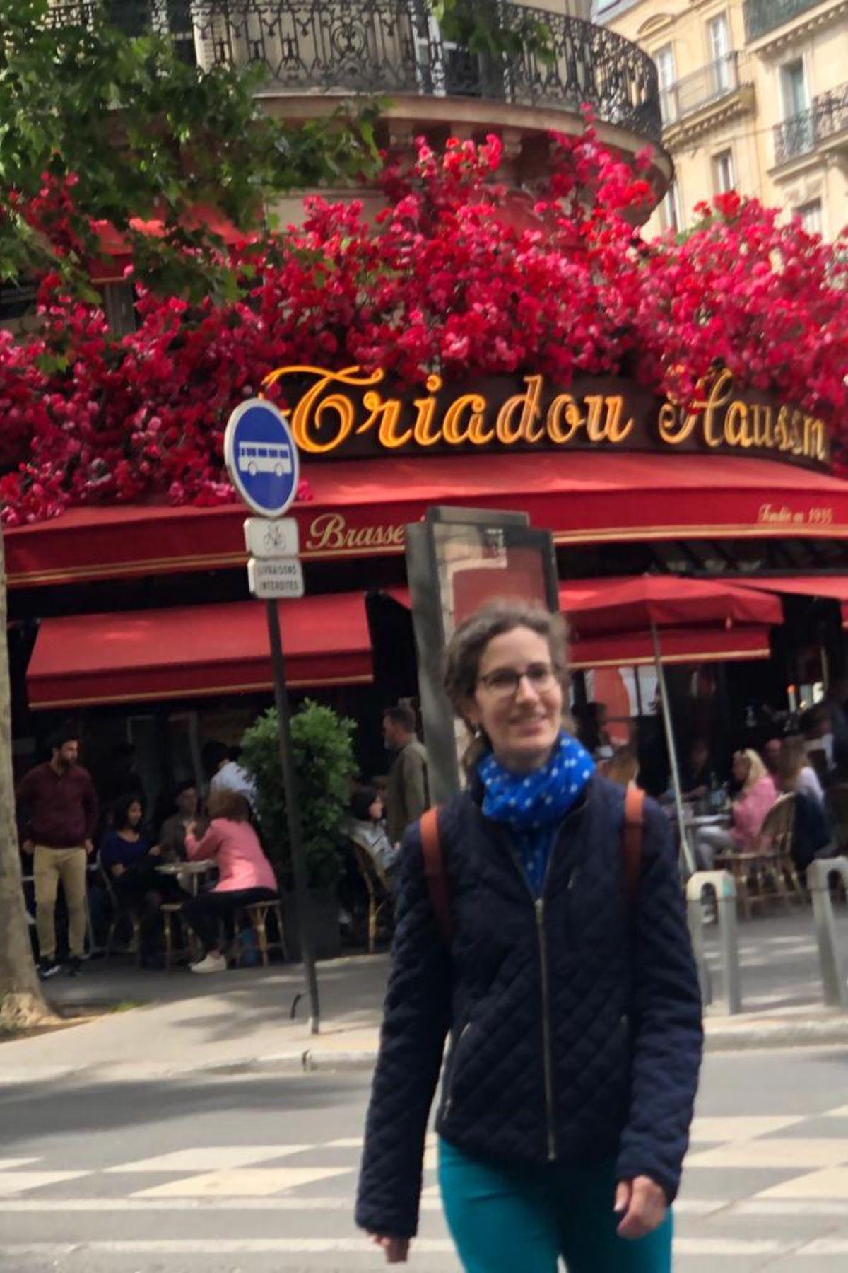 A Parisian woman walking in Paris streets.