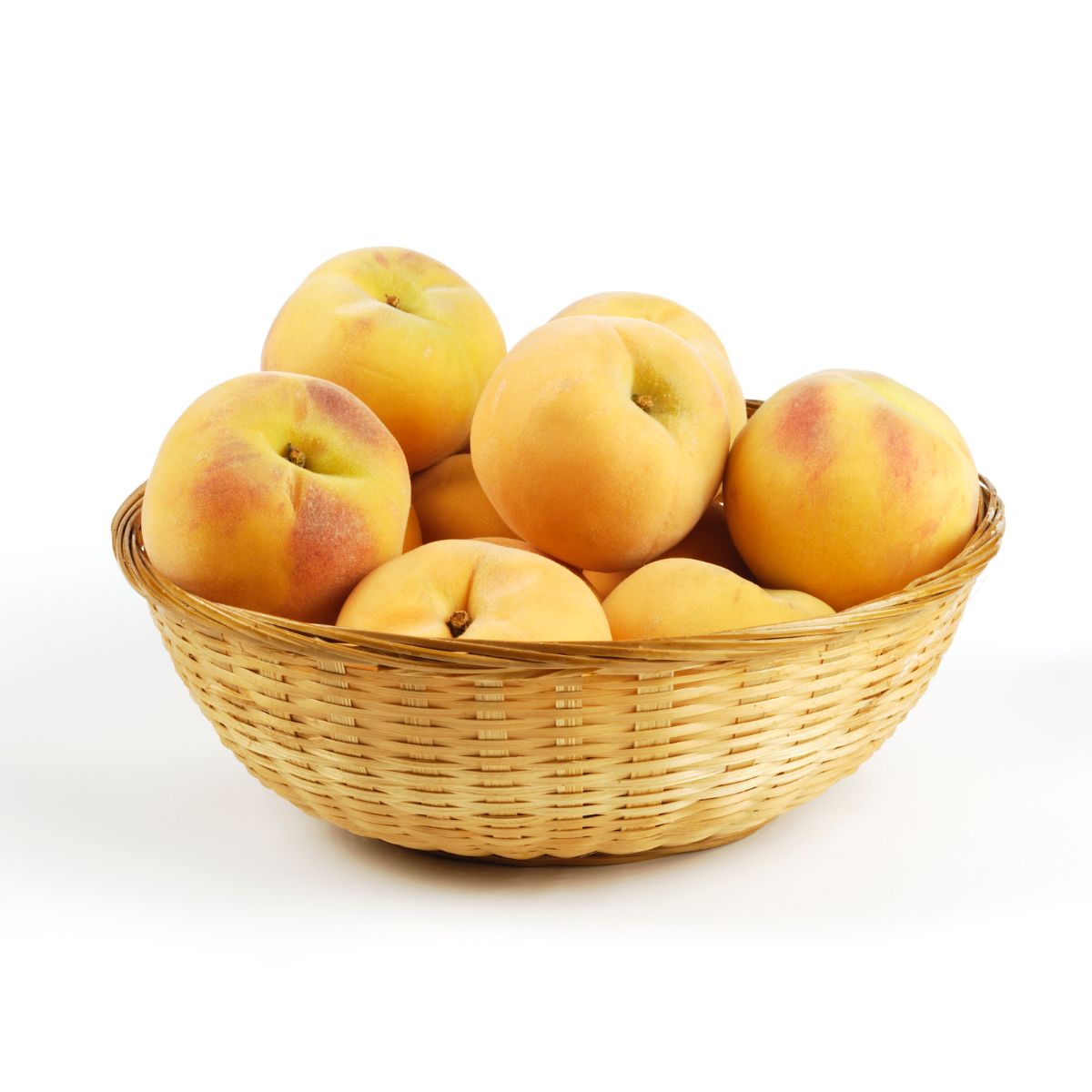 A bunch of yellow peaches in a basket.