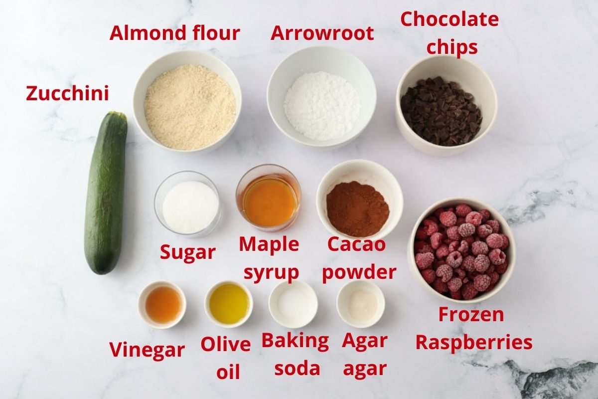 All the ingredients for the gluten free chocolate raspberry cake spread on the kitchen counter.