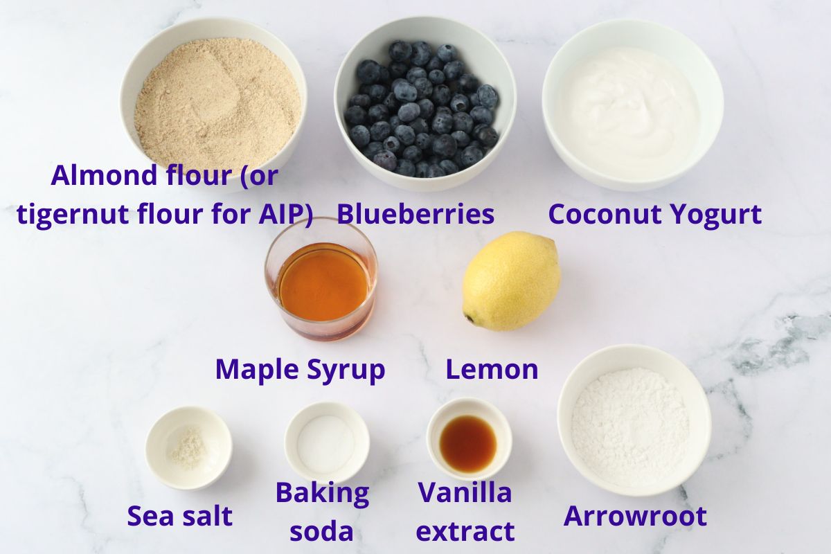 All the lemon blueberry muffins ingredients spread on a kitchen counter.
