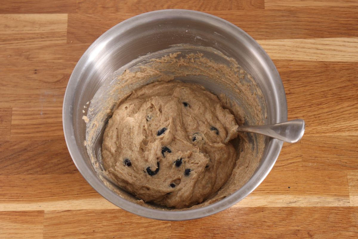 The muffin dough once the blueberries have been folded to it.